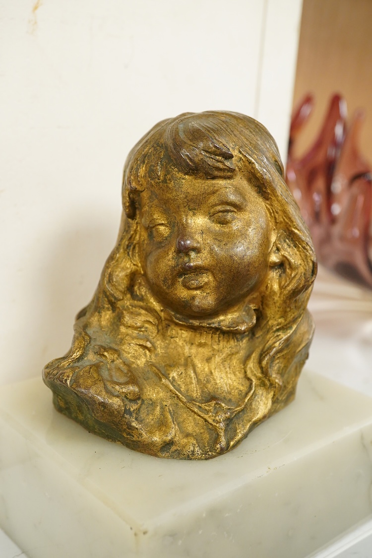 A late 19th century gilt bronze bust of a girl, indistinctly signed, raised on marble base, 16cm high